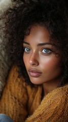 Portrait of a thoughtful woman in cozy sweater indoors