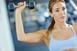 © ReeseBuyout3/peopleimages.com - Dumbbell, training and weights with woman in gym for muscle workout, performance and fitness. Weightlifting, strong and sports athlete with person and exercise for energy, wellness and health