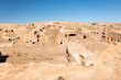 © AmazingAerialAgency - Aerial view of beautiful arid landscape with ancient rock formations and caves, Mardin, Turkiye.