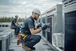 © pavlofox - Techs servicing rooftop AC units at a busy site