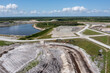 © AmazingAerialAgency - Aerial view of Sunshine Mine with surrounding lake and industrial landscape, Fellsmere, United States.