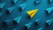 © K-MookPan - Top view of paper airplanes with one yellow airplane leading among blue ones on a flat color background, concept for a business leader or team manager stock photo style.