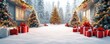 © ZpongXED - Snowy Christmas scene with decorated trees and red gift boxes outside cozy houses, creating a festive holiday atmosphere.