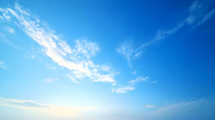 Wall Mural - Bright Blue Sky with Scattered White Clouds, a Beautiful Summer Day with a Clear and Refreshing Atmosphere