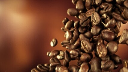 Aufkleber - Super Slow Motion of Falling Coffee Beans. Filmed on High Speed Cinema Camera, 1000 fps. Blur Abstract Smooth Bokeh Background.