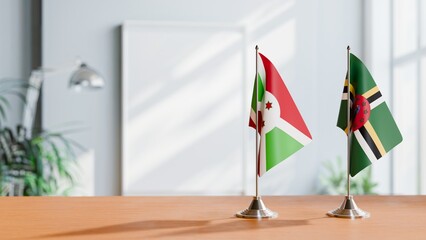 FLAGS OF BURUNDI AND DOMINICA ON TABLE