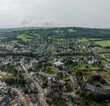 © AmazingAerialAgency - Aerial view of a beautiful village with fields and homes amidst green countryside, Malmedy, Belgium.