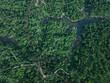 © AmazingAerialAgency - Aerial view of lush green Ramgarh Tea Garden with winding roads and a serene river, Khagrachari District, Bangladesh.