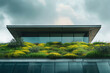 © Piotr - A modern building with a green roof covered in plants