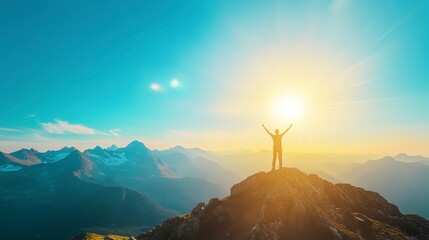 Poster - A silhouette of a person celebrating on a mountain peak with the sun shining bright over distant mountains.