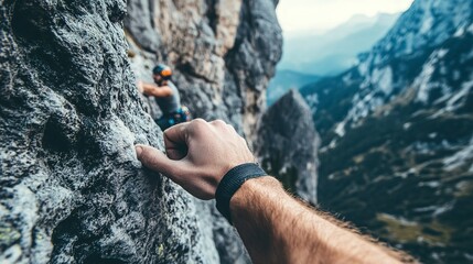 Canvas Print - A close-up photo of a climbers hand gripping a rocky ledge during a mountain ascent. The climbers teammate can be seen reaching out in the background