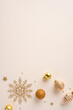 © ActionGP - Festive gold Christmas vertical decorations including baubles and a snowflake on a neutral beige surface creating a sophisticated holiday atmosphere