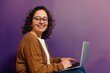© Rawpixel.com - Woman wearing glasses smile to a camera with a laptop background happy electronics.