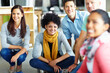 © Leffy/peopleimages.com - Creative, workshop and portrait of business people on floor in office for happy collaboration, planning and solidarity. Team building, men and women at design agency for support, workflow and synergy