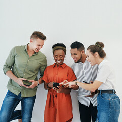 Sticker - Business people, team and pointing to phone in studio for communication and discussion of social media post. Professional, group and smartphone for internet meme, relax and mockup on white background