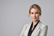 © ThomasLENNE - caucasian successful confident young businesswoman ceo boss bank employee worker manager with arms crossed in formal wear isolated in white background