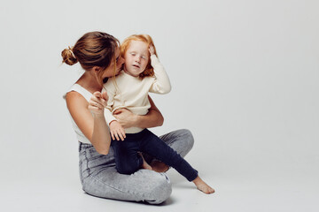 Wall Mural - Mother and daughter embracing in a warm and loving moment of connection and affection