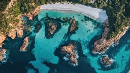 Wall Mural - Aerial view of a stunning coastal landscape with turquoise waters and rocky formations.