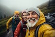 © Vorda Berge - Smiling portrait of senior hikers taking selfie while hiking in mountains