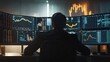 © tapong117 - Financial trader at modern desk with multiple monitors displaying prices and stock market data
