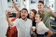 © Frank Coop/peopleimages.com - Excited, business people or selfie with photography at office for picture, team building or memory together. Young group, employees or colleagues with smile for fun day or bonding moment at workplace