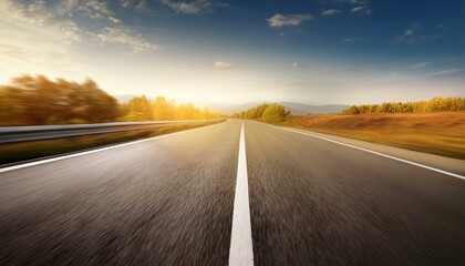 An empty road is depicted with a blurred background to convey motion.