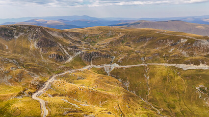 Wall Mural - Aerial drone footage of  Sureanu mountains, Alba county, Transalpina, Transylvania, Romania. Romanian wild nature and landscape from above. Drone photography. Transalpine road in Romania. 