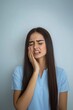 © Rawpixel.com - A woman is experiencing tooth pain shirt blue long.