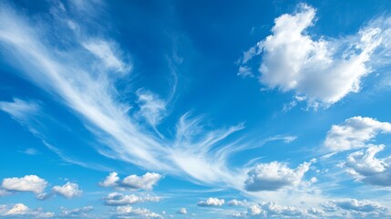 Poster -  A crystal-clear, sunny day with a blue sky dotted by white clouds and a solitary plane in the distant horizon