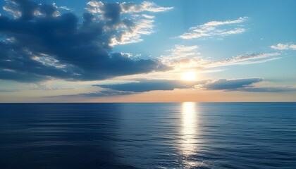 tranquil seascape at sundown with vibrant blue sky and golden sun reflecting on the serene waters