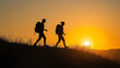 © Andres Mejia - Two hikers walking up a hill at sunset