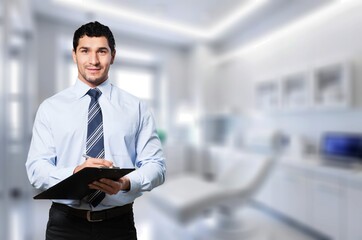 A smiling doctor at work in modern hospital