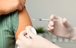 © Tahir - Health care, corona virus, hand of woman nurse, doctor giving syringe vaccine, injection dose on arm sick patient at clinic. Vaccination, immunization disease prevention against flu pandemic influenza