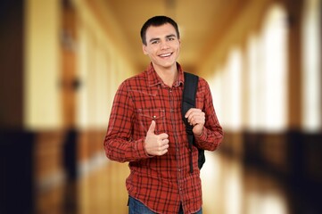 Canvas Print - Portrait of thinking student posing. Education concept.