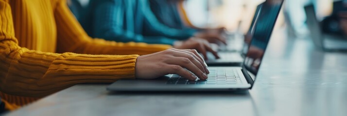 Programmer typing code on a laptop, focusing on software development, coding, and technology in a modern workspace