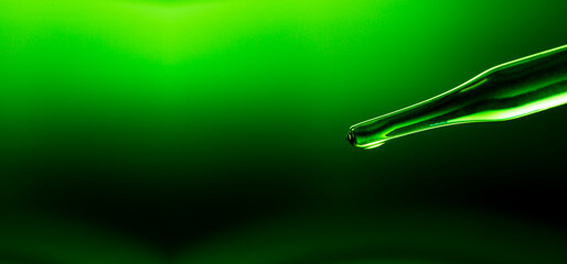 Wall Mural - close-up science experiment green background,macro green science experiment background,lab glassware
