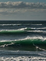 Poster - Kitesurfer in the waves off Ireland's coast.