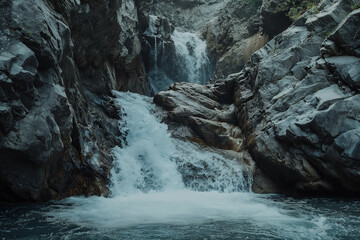 A waterfall with water cascading down the rocks