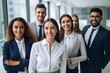 © useful pictures - This group of six professionals stands confidently in a contemporary office environment, all wearing professional attire and smiling for the camera