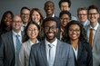 © Yuliia - Beautiful group of multicultural business men and women, all smiling and wearing eyeglasses, on a gray background.