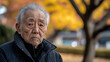 © Antto-AI - Elderly man with thoughtful expression in park setting