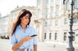 © boryanam - Beautiful young woman with phone on the street in Italy
