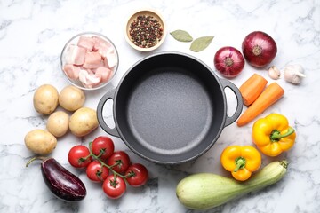 Wall Mural - Uncooked ingredients for stew on white marble table, flat lay