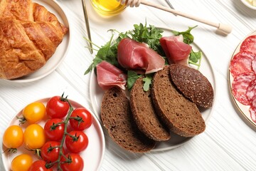 Poster - Different tasty food served for brunch on white wooden table, flat lay