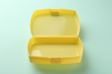 Wall Mural - One empty lunch box on light blue background