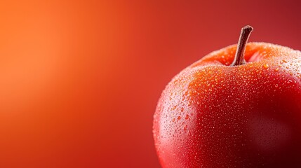 Wall Mural -  Red apple with water droplets, against a solid red backdrop