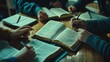 © Elmira - A group of friends is deeply engaged in a Bible study session, discussing insights from their open Bibles while taking notes in their notebooks