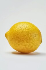 Sticker - A lemon sitting on a white surface