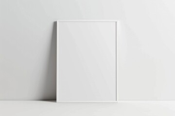 Canvas Print - A blank picture frame leaning against a wall