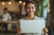 © mattegg - Smiling Woman Holding a Blank Sign for Your Message